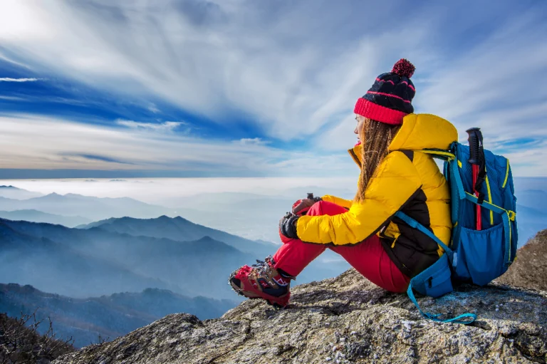 Traveler planning a budget trip with a map and calculator